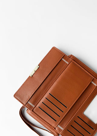 Brown leather wallet on a white background