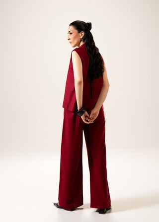 Sleeveless Linen Blend Shirt – WS25-223 for Women – In-Transit Collection | KOA | Shop Online.
Woman wearing a red sleeveless top and wide-leg pants against a white background